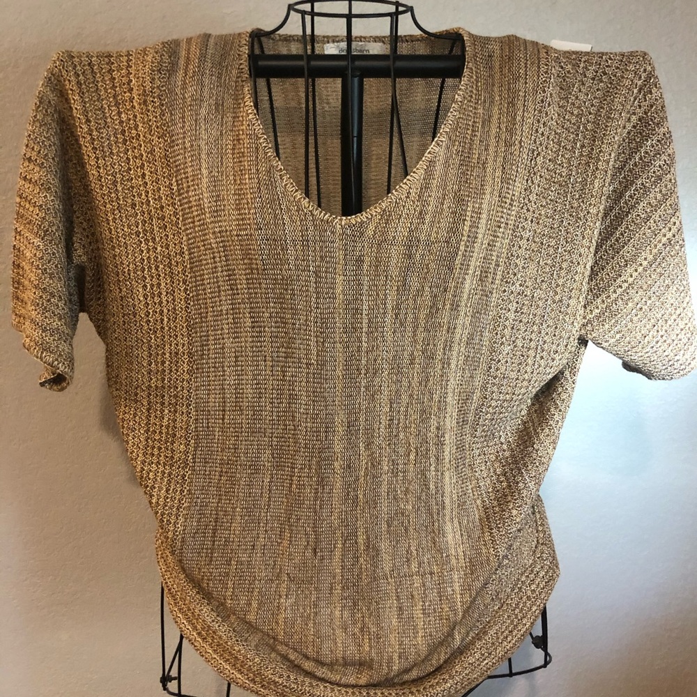 Loose fitting wing sleeve shirt.